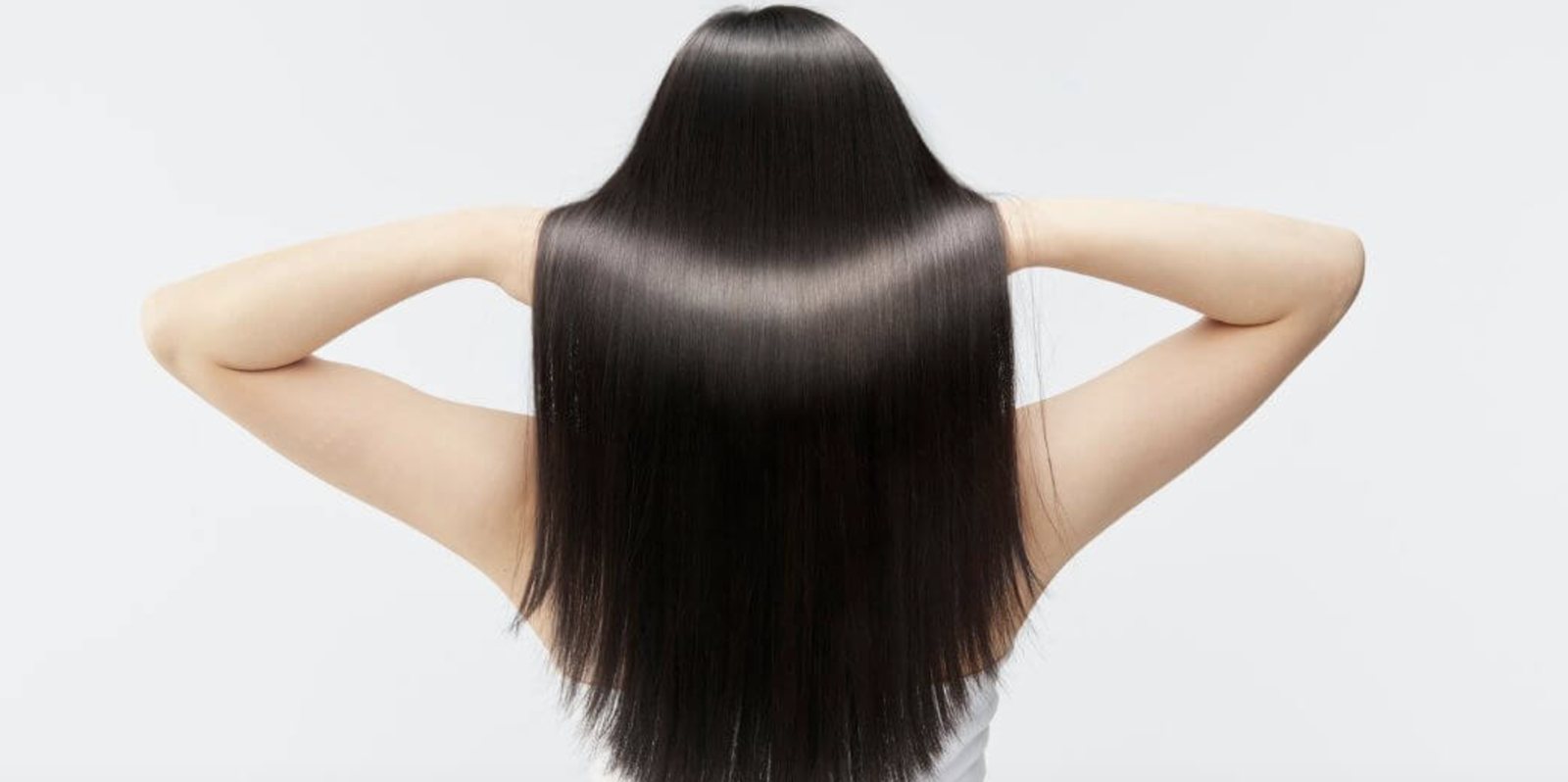Long, straight hair falling smoothly down the back, seen from behind